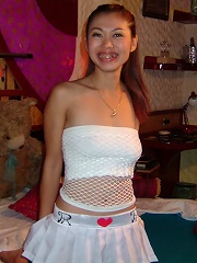 Thai barslut posing in her gogo outfit